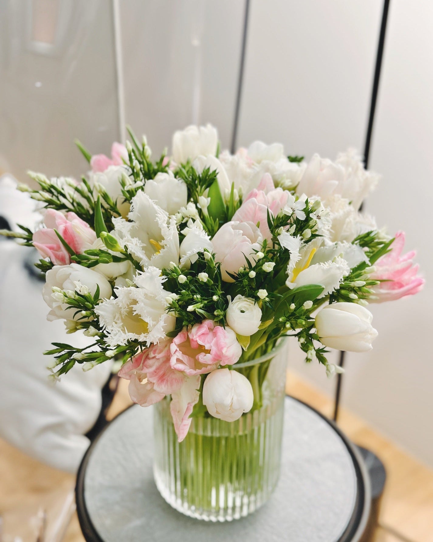 Luxurious Ritzy Petal Parcel with a curated selection of fresh seasonal blooms in elegant vase