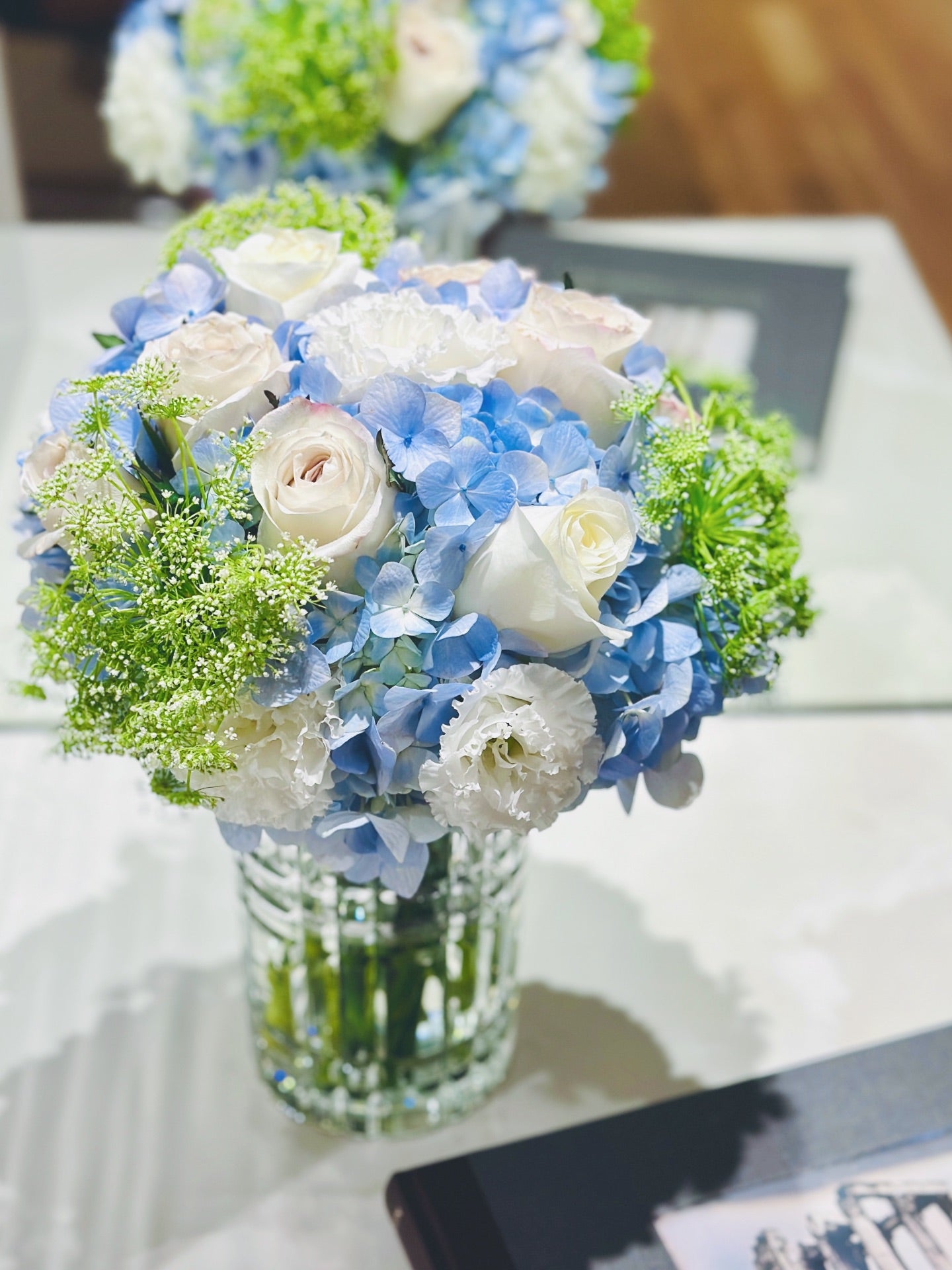 Chic Petal Parcel featuring a curated selection of fresh seasonal blooms in elegant packaging