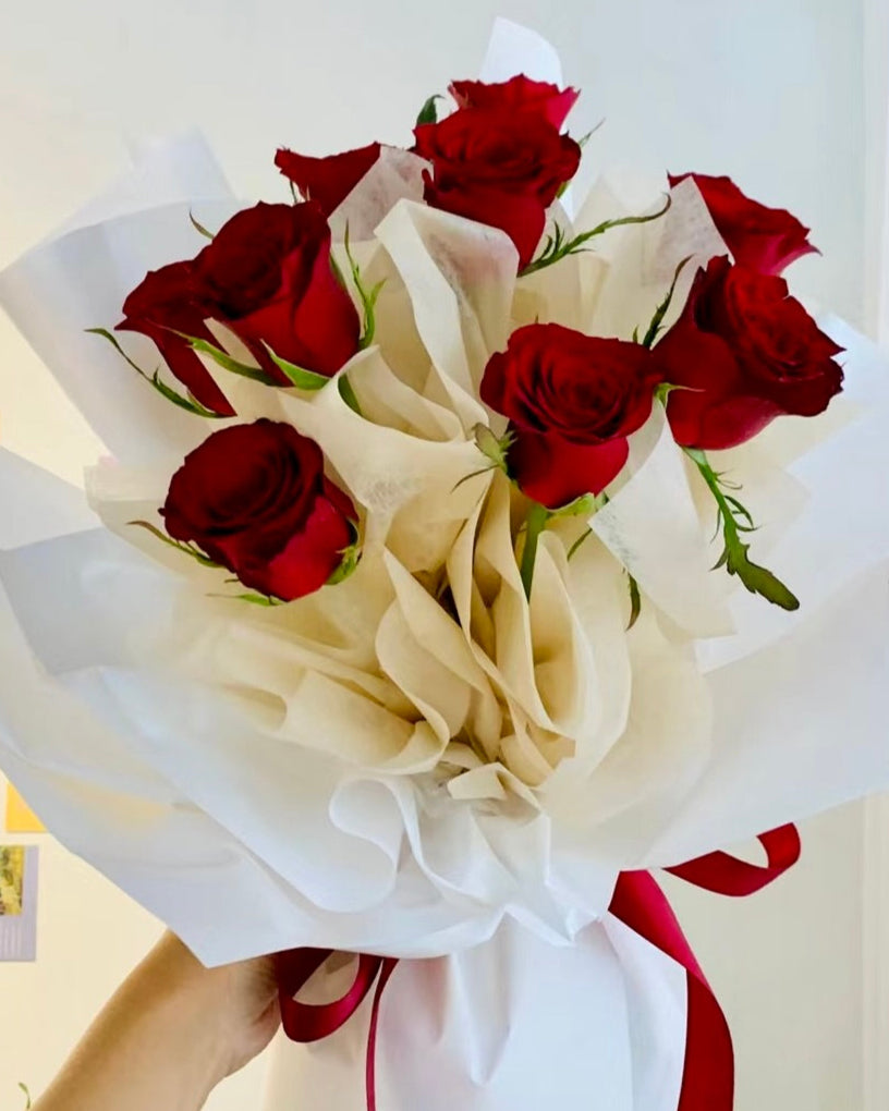 Red Roses Bouquet featuring 10 velvety blooms arranged with lush wrapping