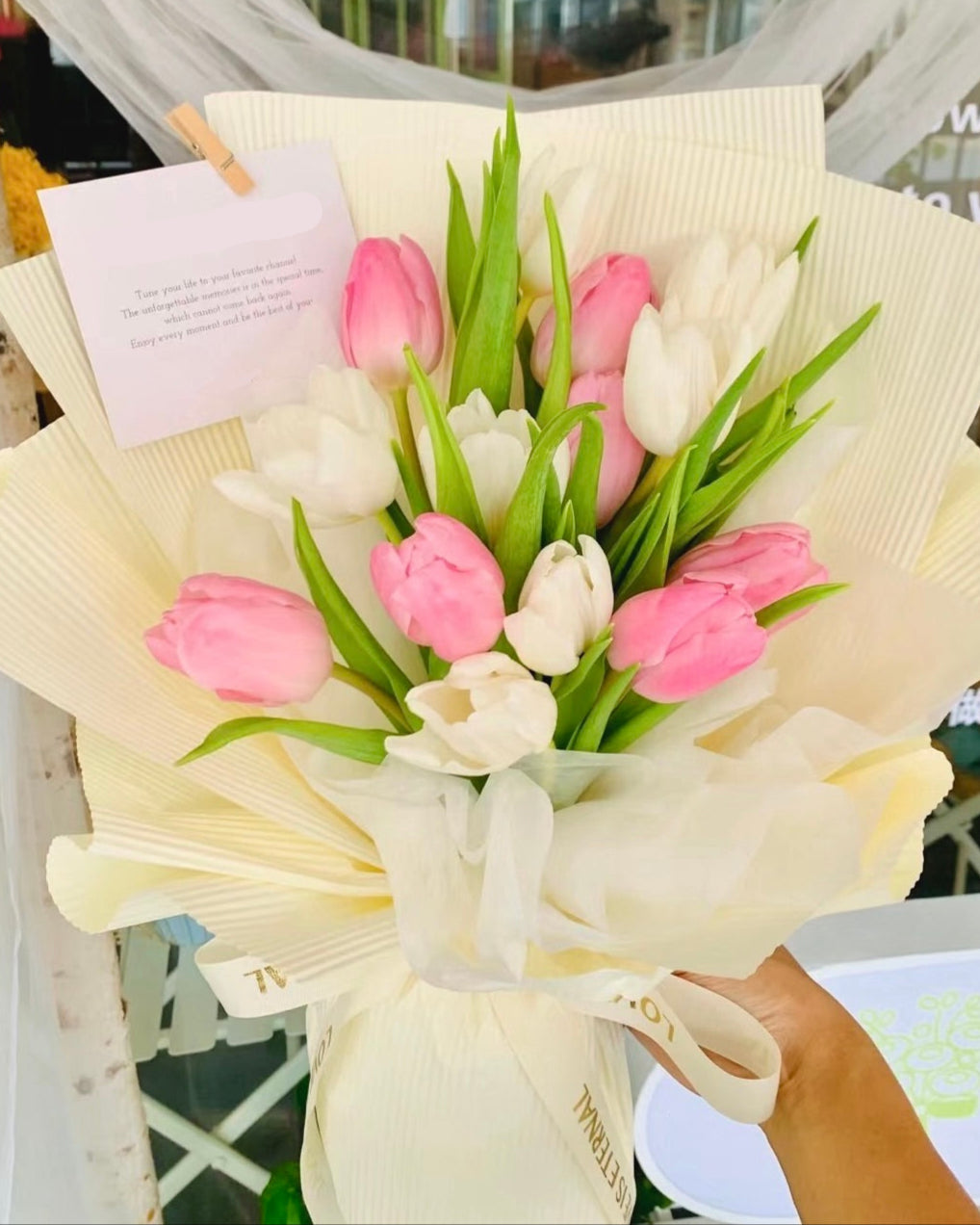 Beautifully wrapped 19 tulip bouquet, ready for gifting to a loved one
