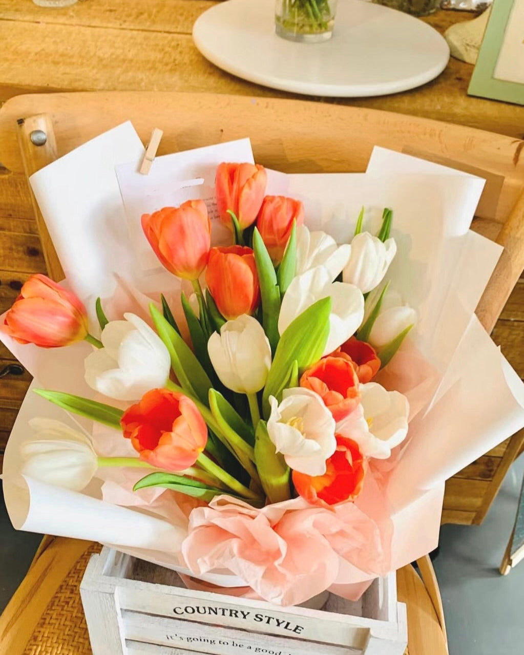 Vibrant bouquet of 19 tulips available in multiple colors, symbolizing love and commitment.