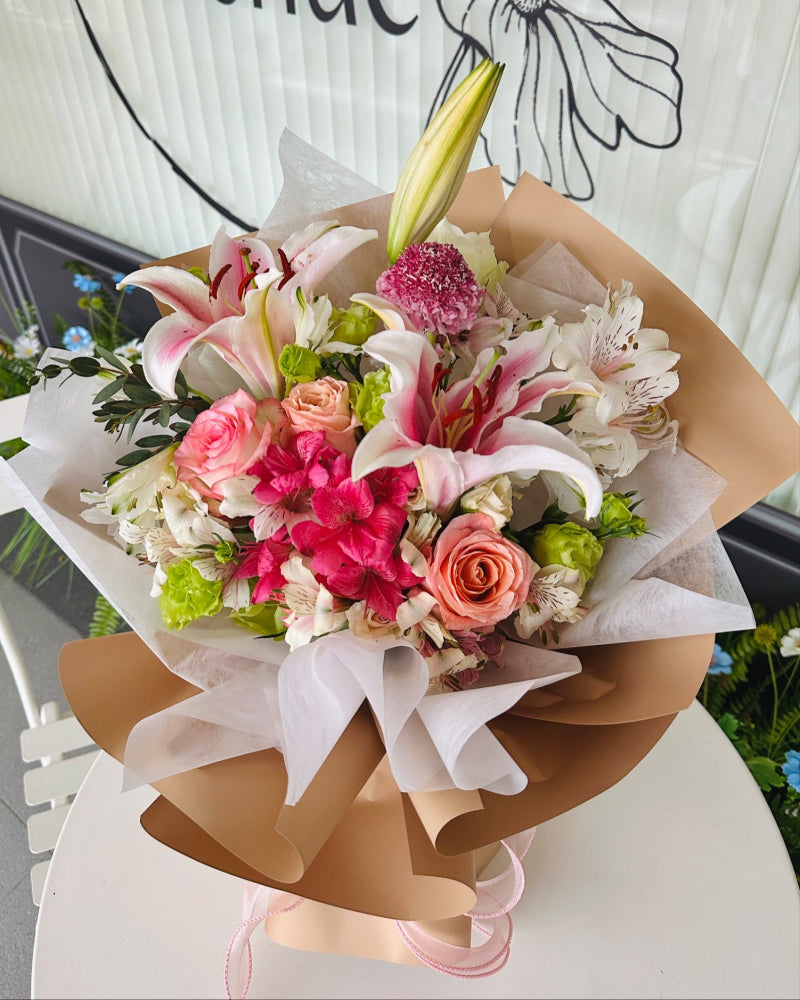 Omakase lily bouquet with white lilies and soft pink accents