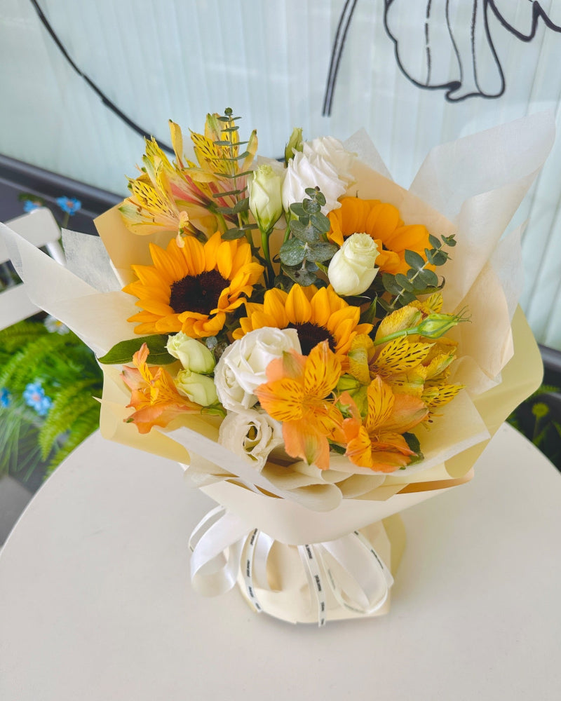 Bright yellow sunflower blooms with cheerful, large petals.