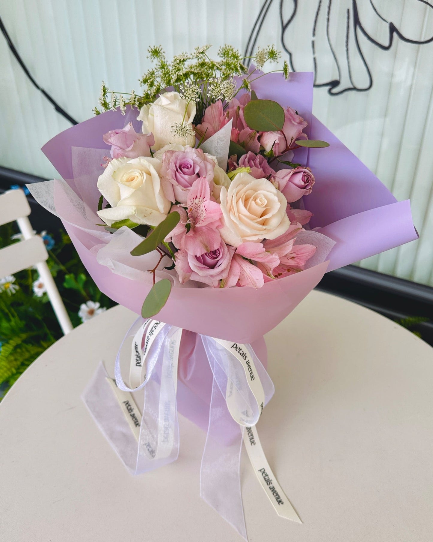 Deluxe filler flowers such as eustomas and spray roses used in the Chic bouquet.