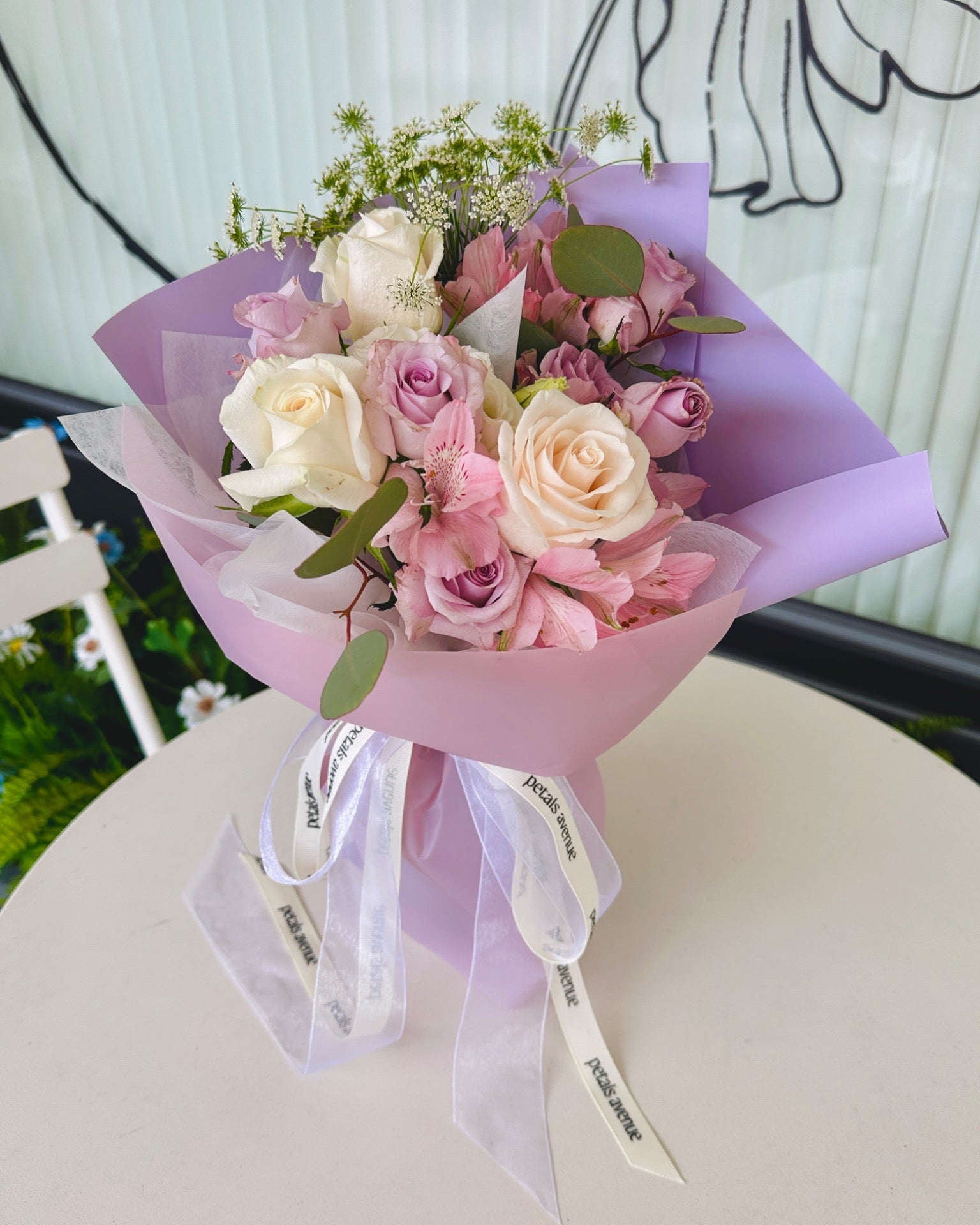 Deluxe filler flowers such as eustomas and spray roses used in the Chic bouquet.