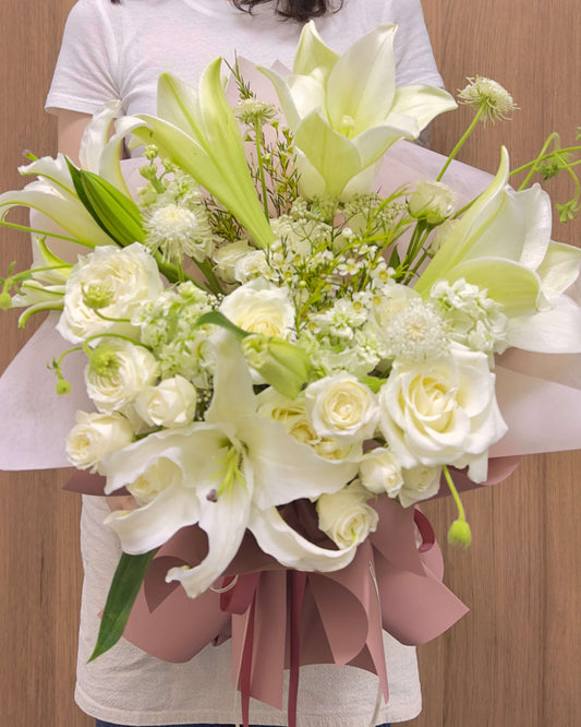 lily bouquet with seasonal flowers in omakase arrangement. light style.