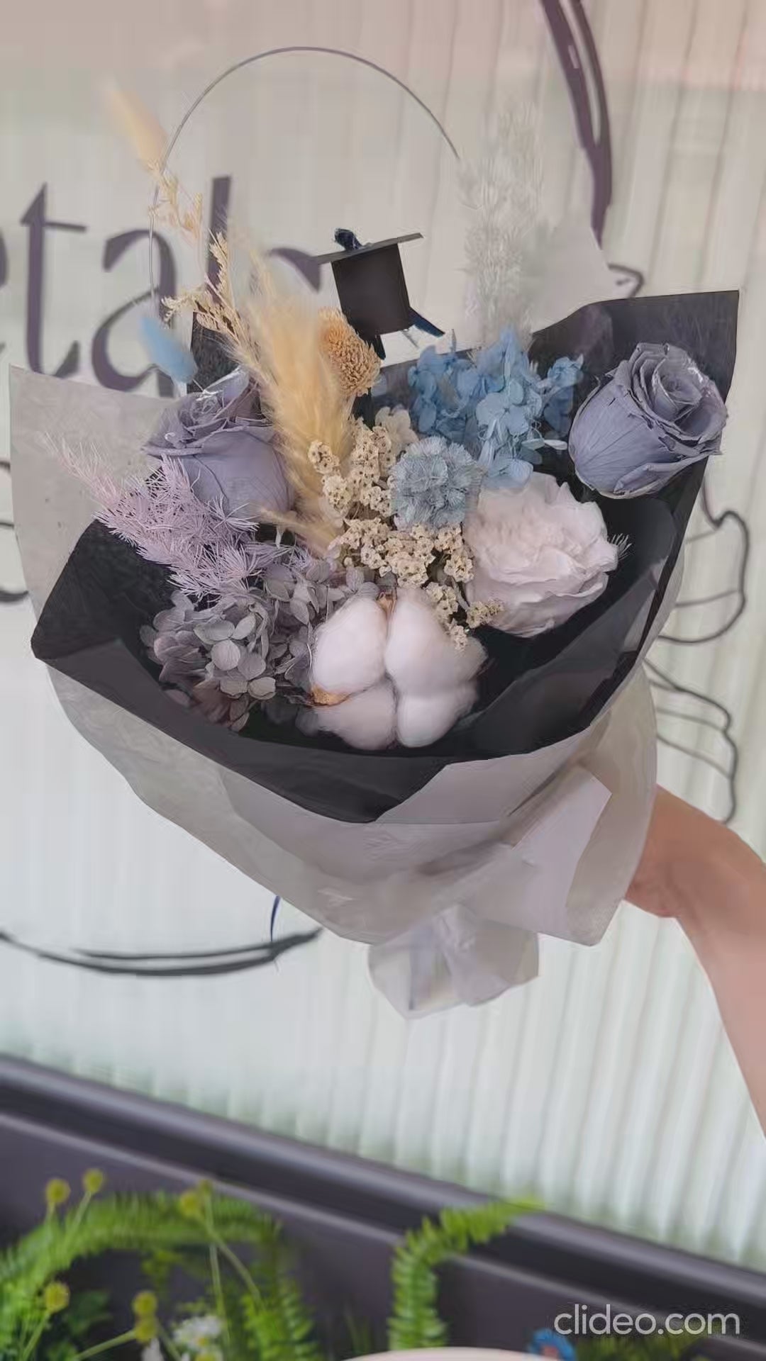 Detailed view of real preserved flowers in the bouquet, showcasing their lasting beauty.