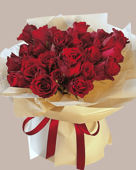 36 red roses wrapped in a natural arrangement style