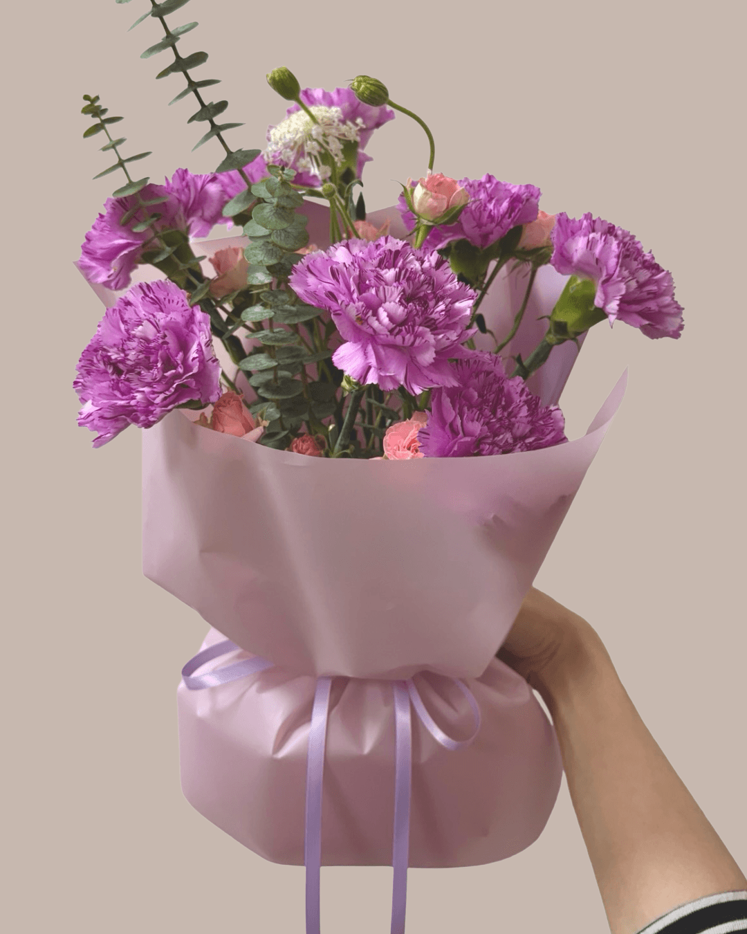 purple carnation bouquet in small size with vibrant filler flowers