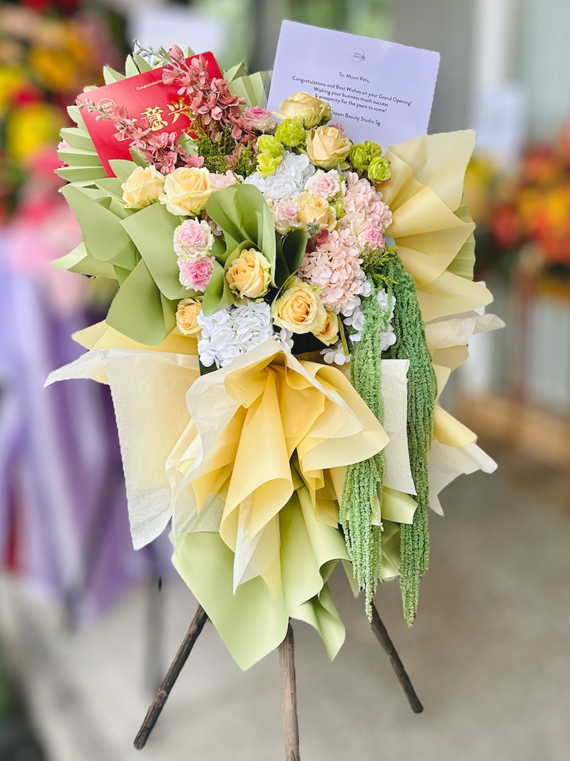 Cheerful Well Wishes Green and Peach Flower Stand