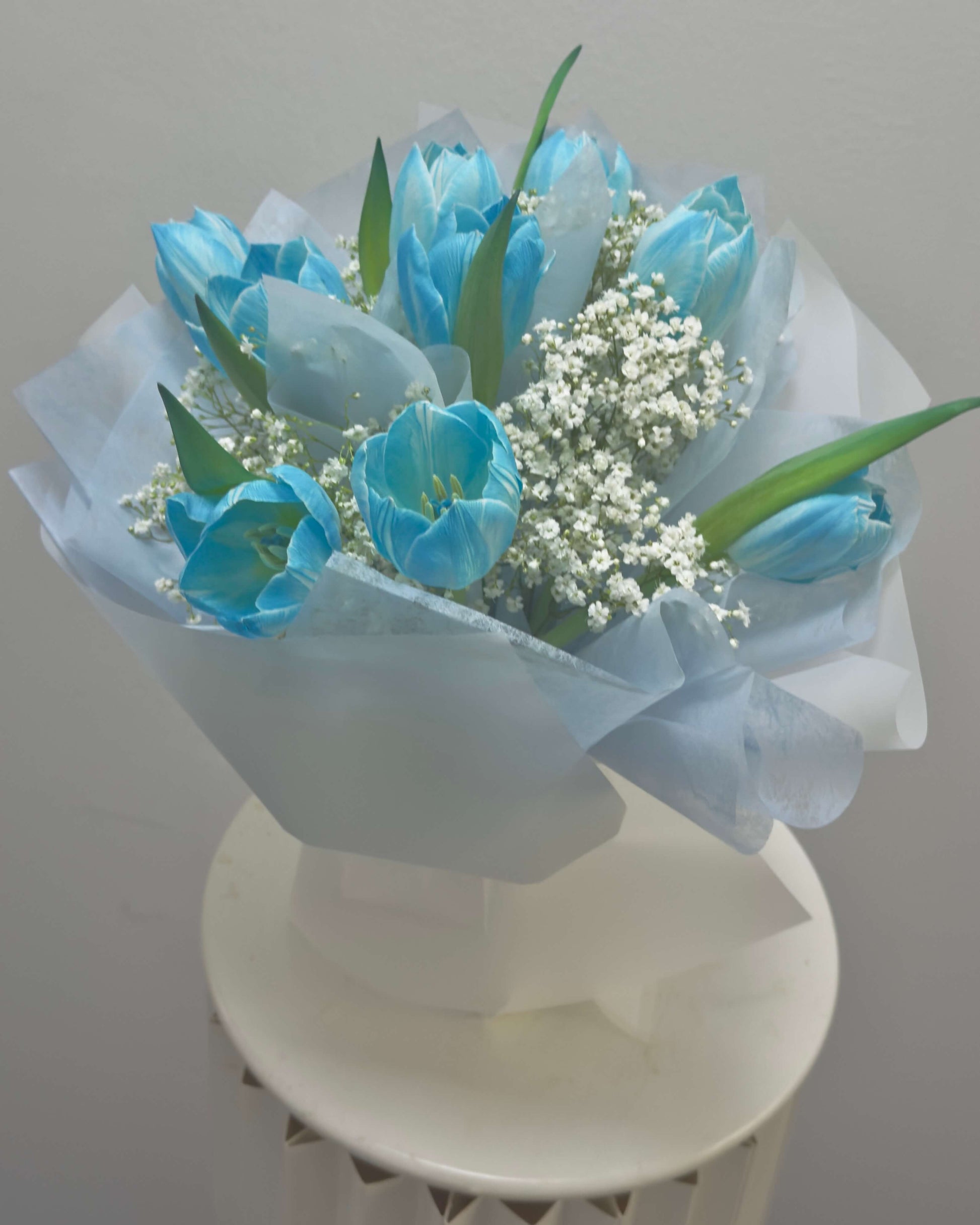 Bouquet of blue tulips with baby's breath 