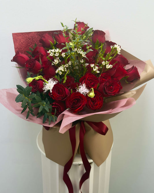 36 red roses with splendid filler flowers and leaves