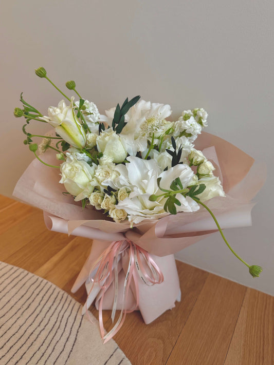 Fresh-cut lilies arranged with seasonal filler flowers in Omakase style