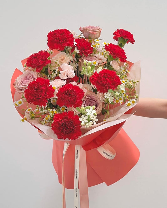Bright and vibrant carnation bouquet with chic filler flowers