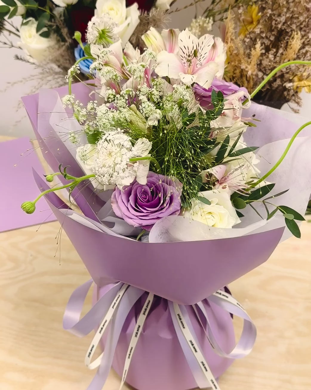 Light and soft styled bouquet featuring a mix of seasonal blooms with Chic filler flowers.
