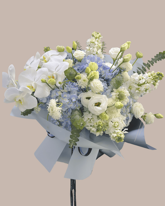 oversized hydrangea bouquet with orchid addon